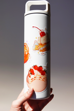 White insulated water bottle decorated with cute dessert-themed vinyl stickers including cherry cupcake, strawberry shortcake, and orange slice illustrations — shown held in hand under studio lighting, aesthetic hydration bottle customization idea